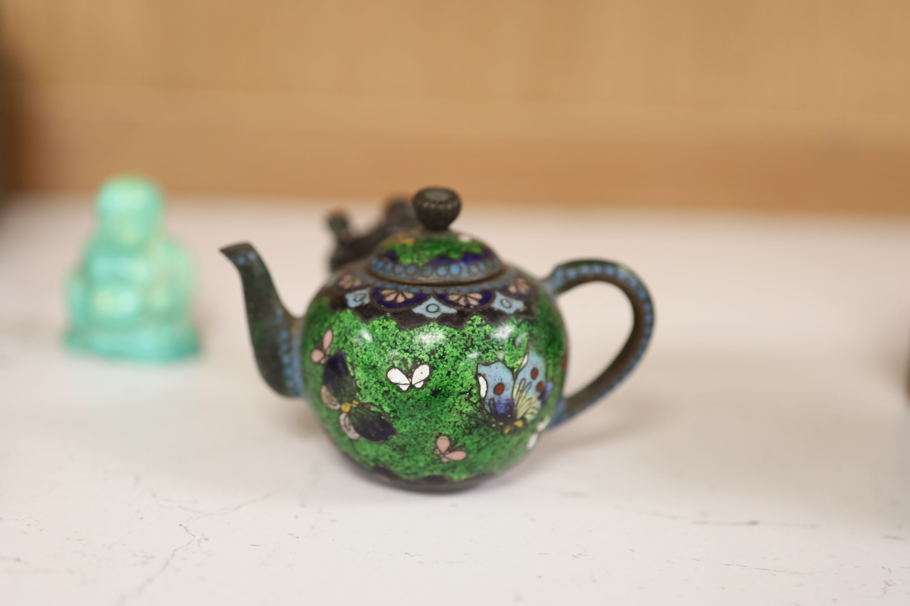 A small miscellaneous Oriental collection including enamel snuff boxes, Buddha carvings etc.